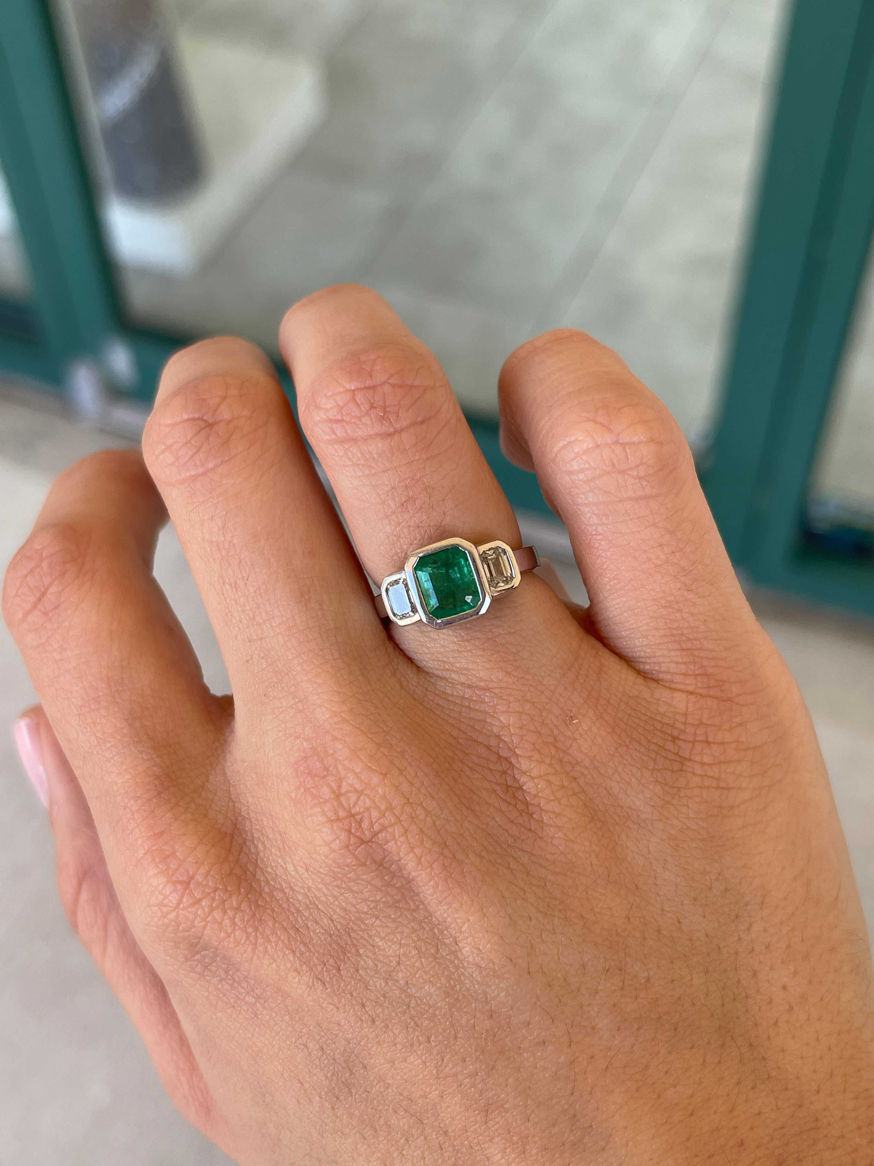 14K gold engagement ring with three emerald-cut natural diamonds totaling 2.25 carats from Colombian Emerald brand.