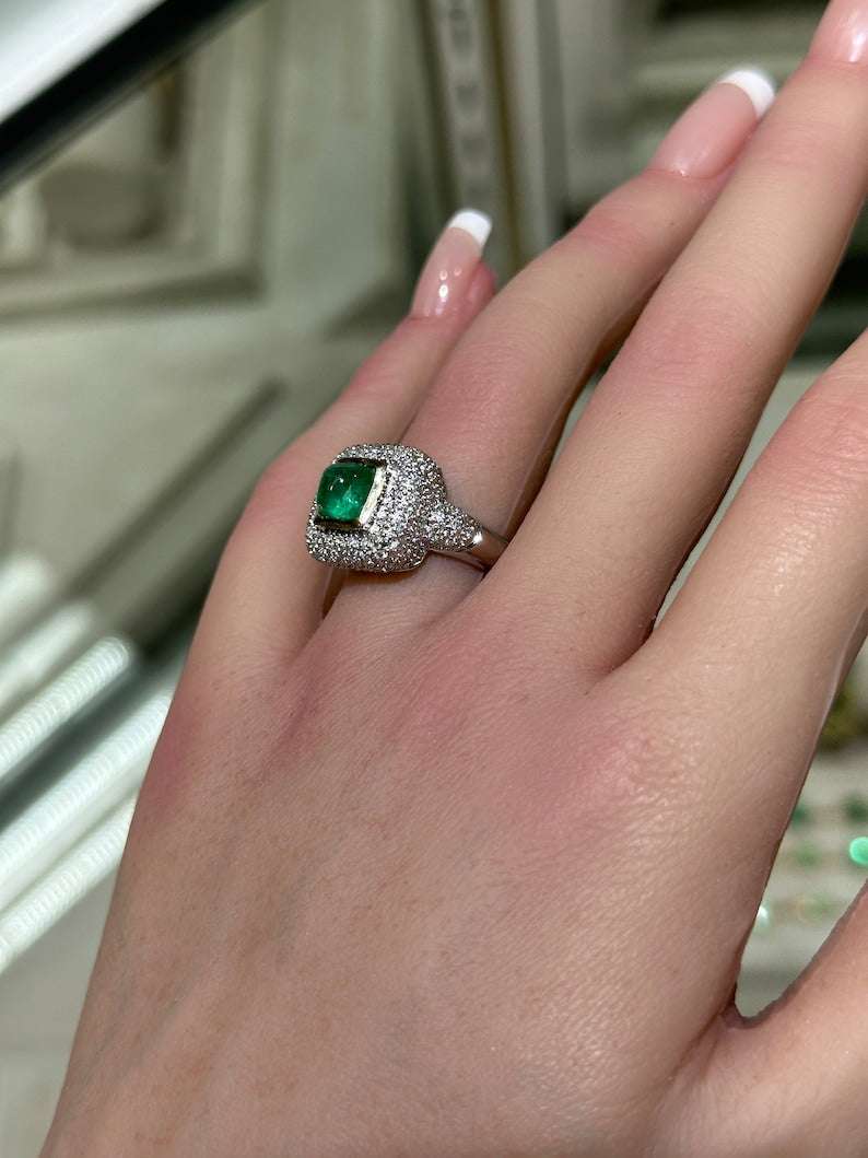 Colombian Emerald engagement ring featuring a 2.54tcw cluster sugarloaf emerald with diamond accents in 14K gold.