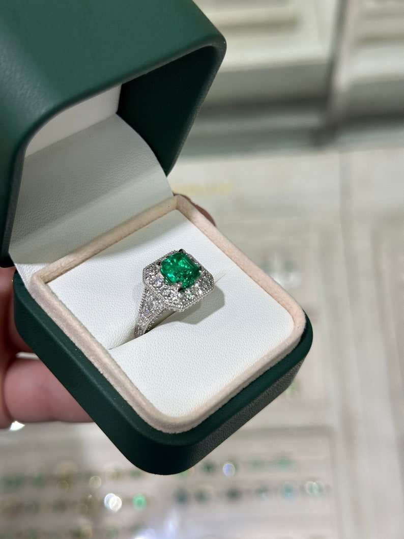 Colombian Emerald 14K engagement ring with a 3.08tcw AAA vivid green emerald cut diamond halo accent.