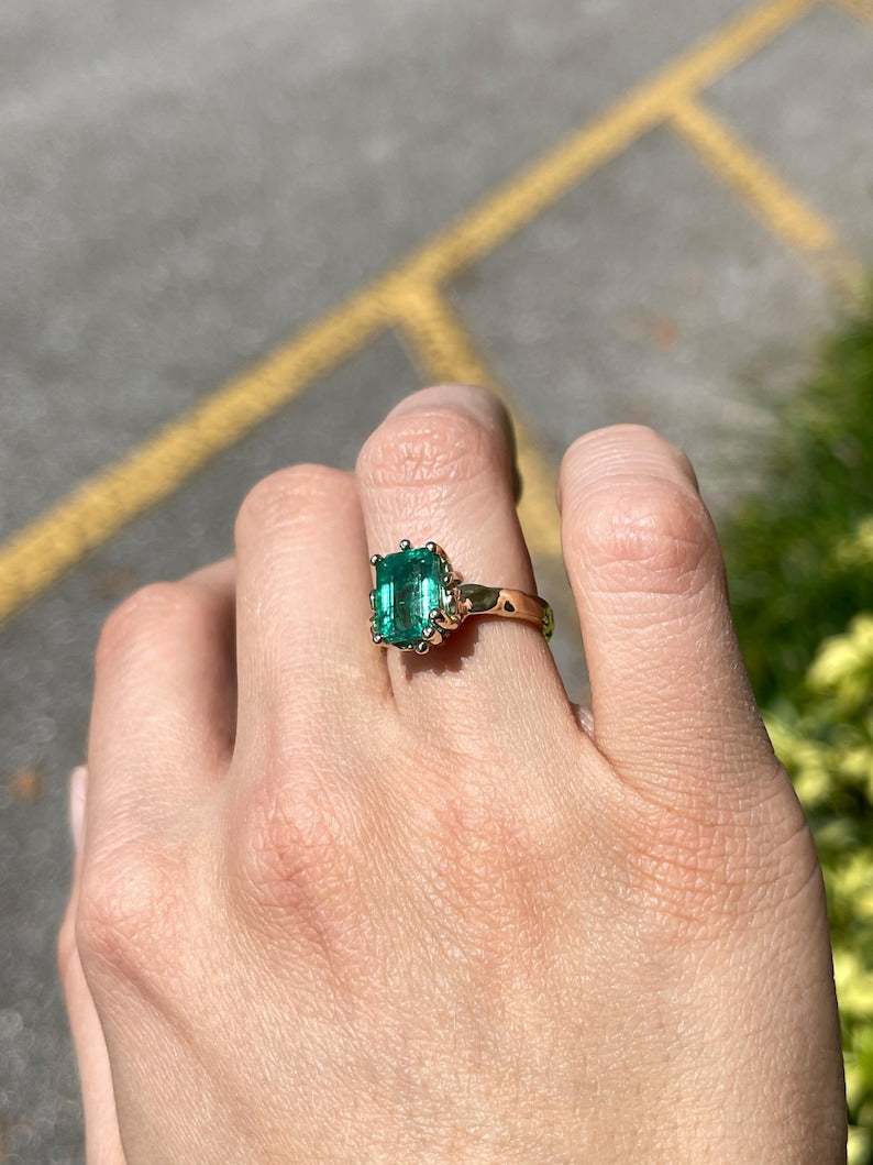 14K gold engagement ring with a 3.10ct lush green emerald solitaire, featuring a Colombian Emerald gemstone.