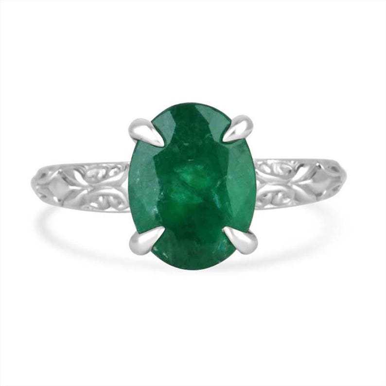 14K white gold engagement ring featuring a 3.11 carat dark green oval emerald solitaire by Colombian Emerald.