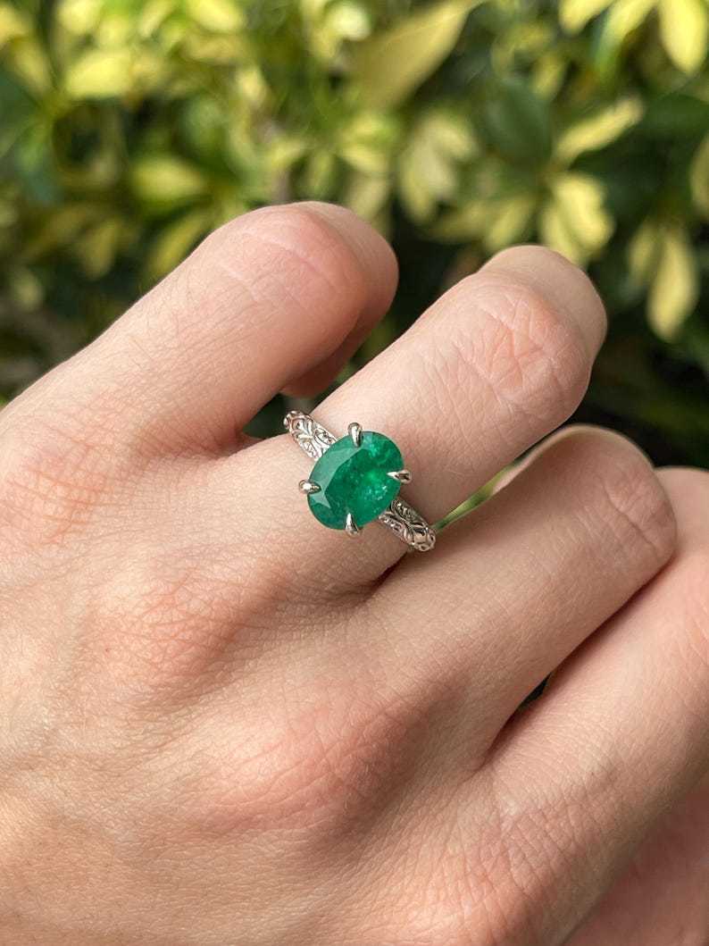 14K white gold engagement ring featuring a 3.11ct dark green oval emerald solitaire by Colombian Emerald