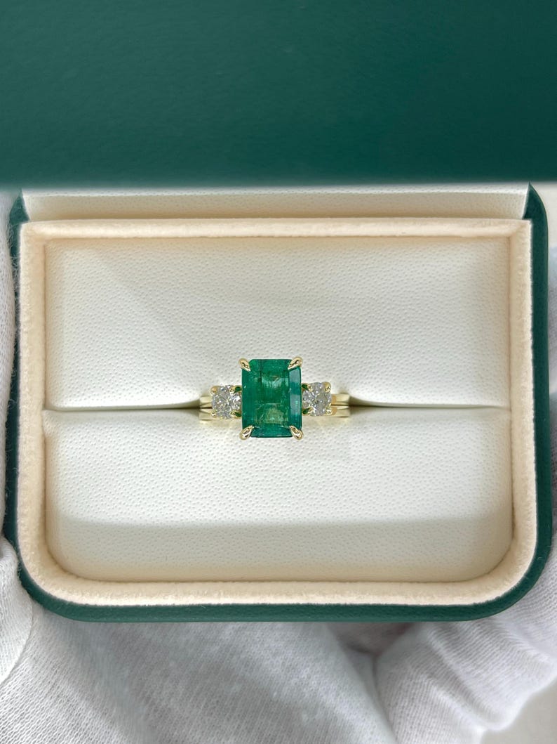 14K Colombian Emerald and diamond convertible three-stone engagement ring with 3.30 carats, featuring natural emeralds and sparkling diamonds.