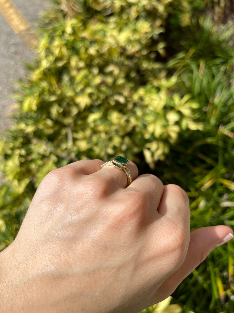 Green emerald cut engagement ring with diamond accents in 14K gold, featuring 3.59 tcw from Colombian Emerald.