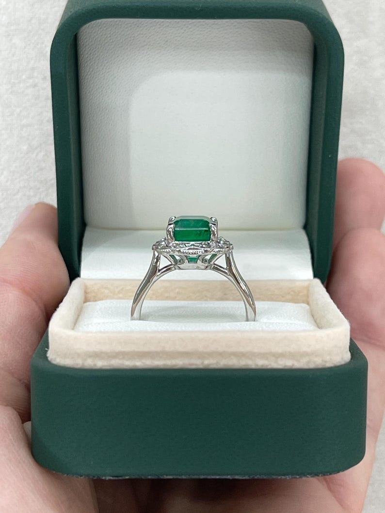 14K white gold engagement ring featuring 3.60tcw green emerald and diamond floral design from Colombian Emerald.