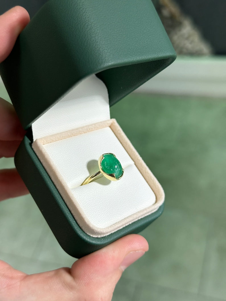 14K dark green oval cabochon emerald solitaire engagement ring with a 4.29 carat Colombian Emerald gemstone.