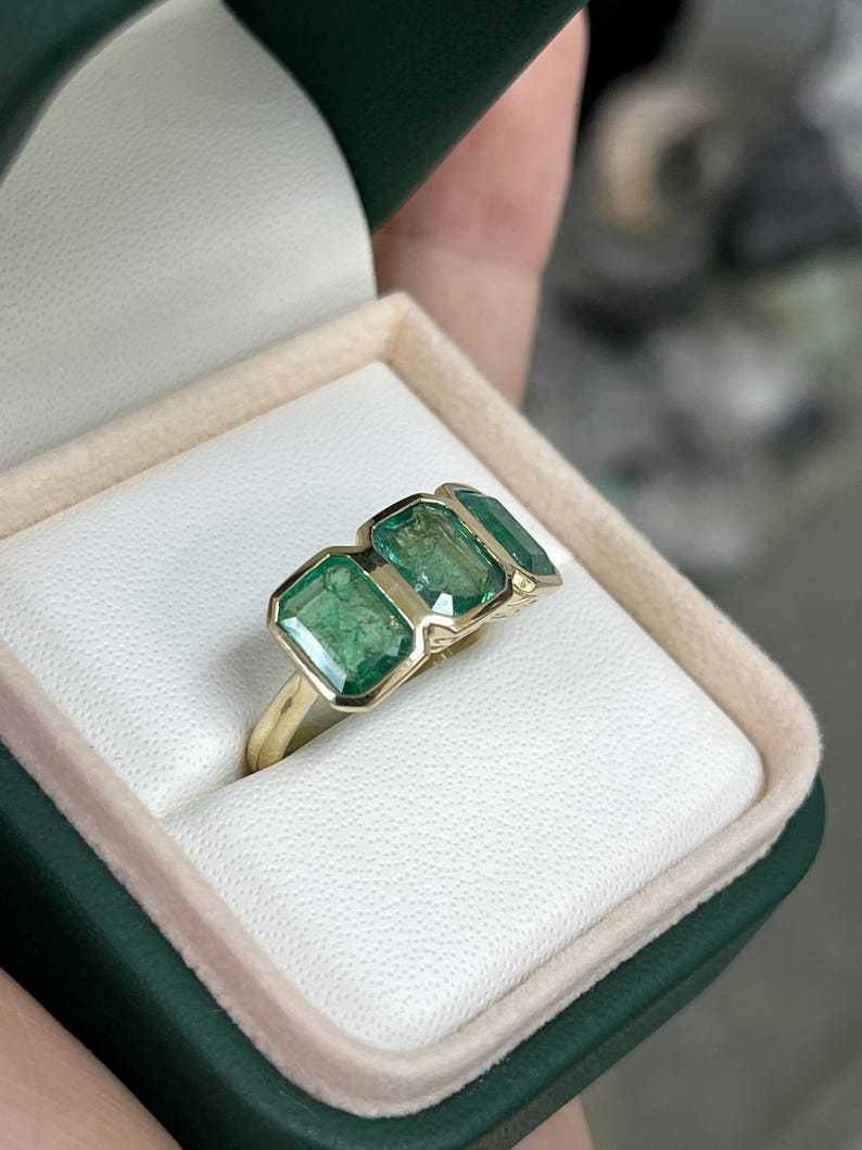 4.40tcw Bezel Set Emerald Cut Trilogy Ring Vintage Scroll Detail 14K Y