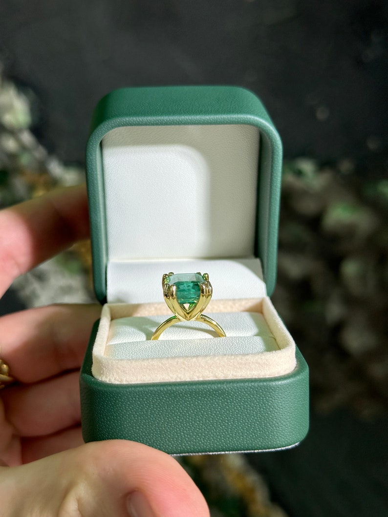 Colombian Emerald 14K engagement ring with a 7.35ct emerald cut solitaire gemstone in chunky claw prongs