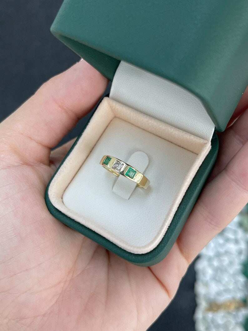 Ladies emerald ring featuring a 0.68 tcw vivid green diamond and emerald princess cut band in 14K gold by Colombian Emerald.