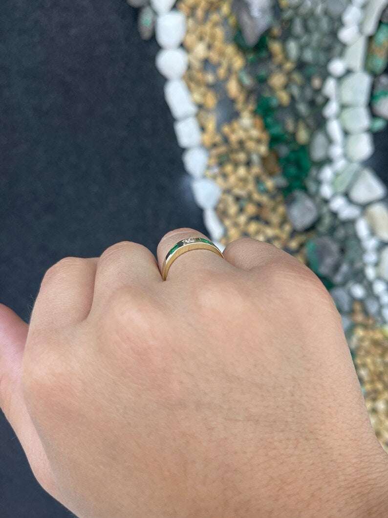 Ladies emerald ring featuring a 0.68tcw vivid green diamond and emerald princess cut band in 14K gold by Colombian Emerald.