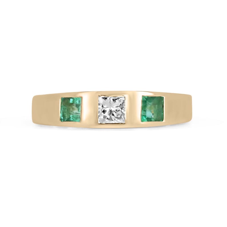 Ladies emerald ring featuring a 0.68ctw vivid green diamond and emerald princess cut band in 14K gold, by Colombian Emerald.