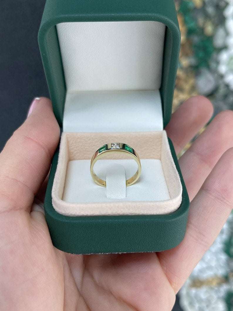 Ladies emerald ring featuring 0.68 carat vivid green diamond and emerald princess cut band in 14K gold by Colombian Emerald.