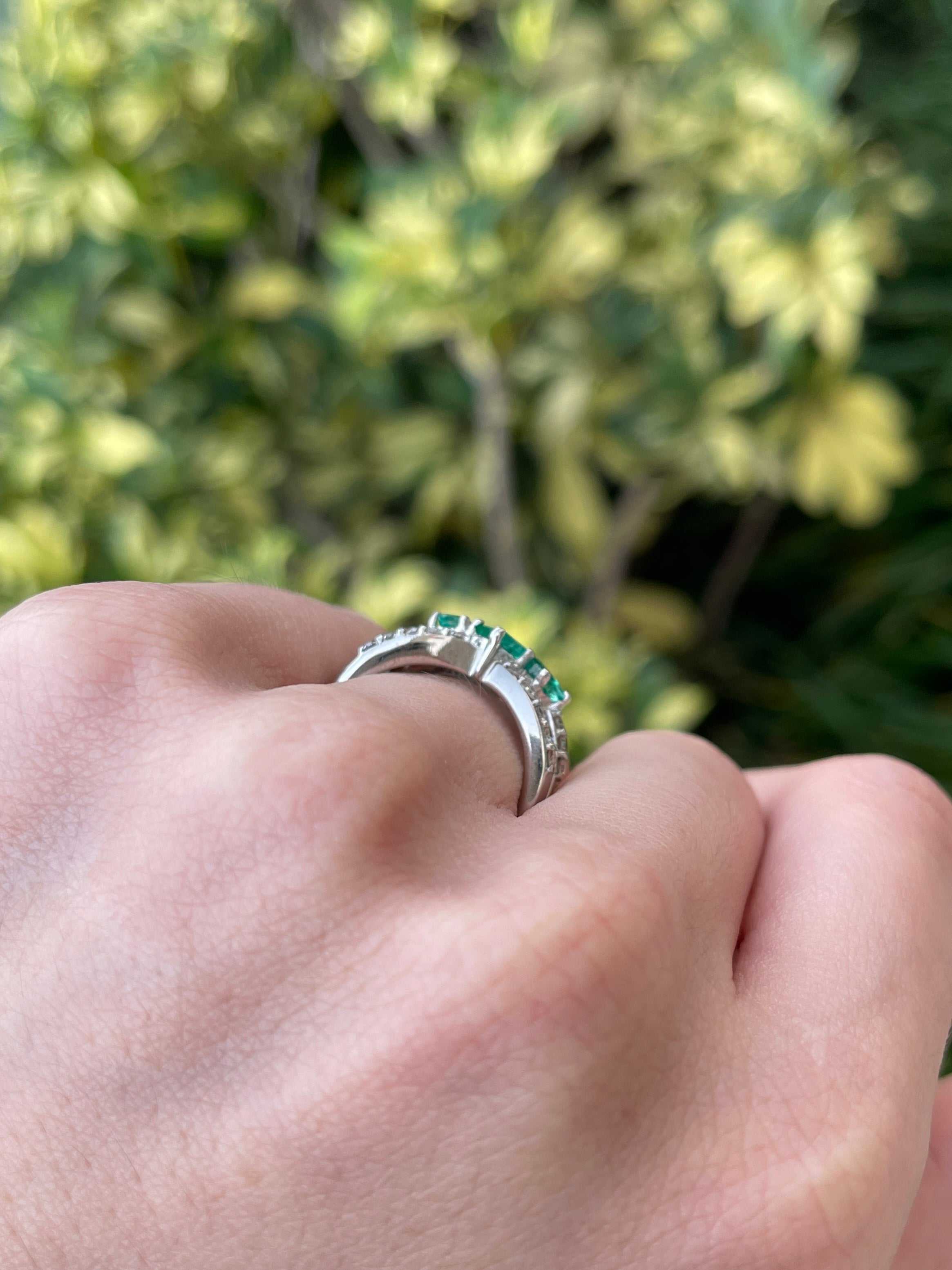 Ladies emerald ring featuring 1.20tcw natural emeralds, diamonds, and a princess cut design in 14K gold with pave shank.