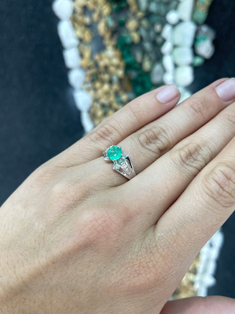 Colombian Emerald ladies ring with 1.25tcw round emerald, tapered baguette diamond accents, 18K white gold, 6-prong setting
