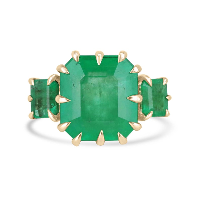 13.73tcw 18K gold ring with three vivid medium green emerald-cut stones and multi-prong setting