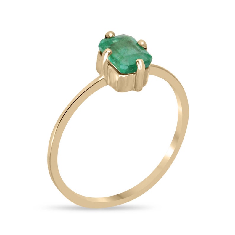 14K gold ladies emerald ring featuring a 0.70ct natural Colombian emerald in a four-prong north-south setting