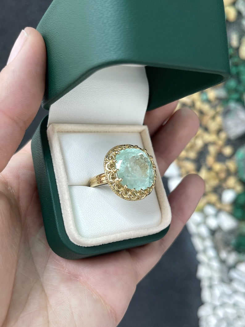 Ladies emerald ring featuring a 16.75ct pale light green cushion cut emerald in 14K gold, vintage-inspired antique design by Colombian Emerald