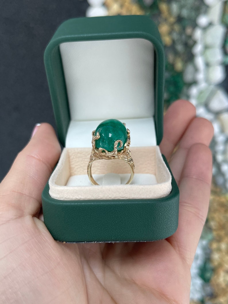 14K gold oval cut emerald solitaire ring with intricate design and prong setting, unisex Colombian emerald jewelry.