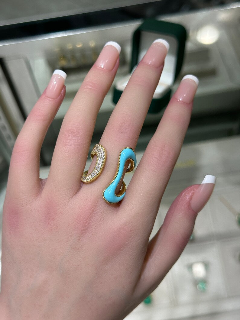 Ladies 14K gold statement ring with 0.40tcw pave diamonds and irregular turquoise accent, featuring an open swirl design.