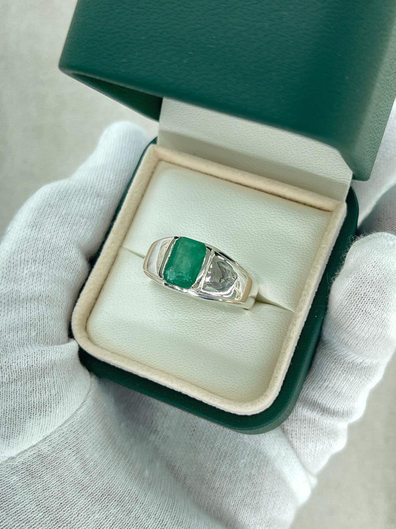 Men's silver ring with 2.75 carat natural emerald cut emerald, half bezel channel setting, Colombian Emerald brand.