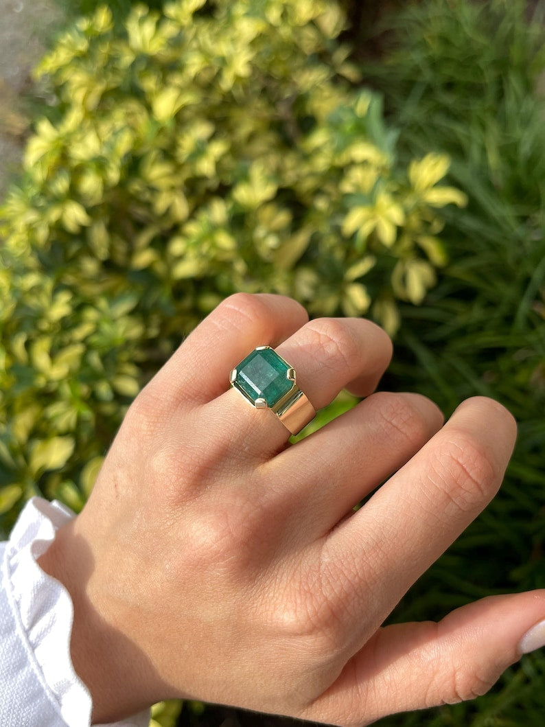 Colombian Emerald men's solitaire ring with a 10.04ct emerald cut pinky ring in 14K gold, wide band, unisex design.