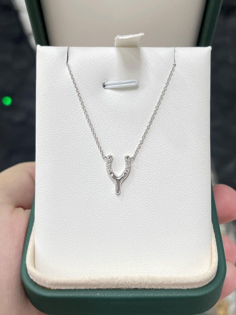 14K gold Y-shaped horse shoe diamond pendant necklace with white gold finish, featuring 0.10tcw diamonds from Colombian Emerald.