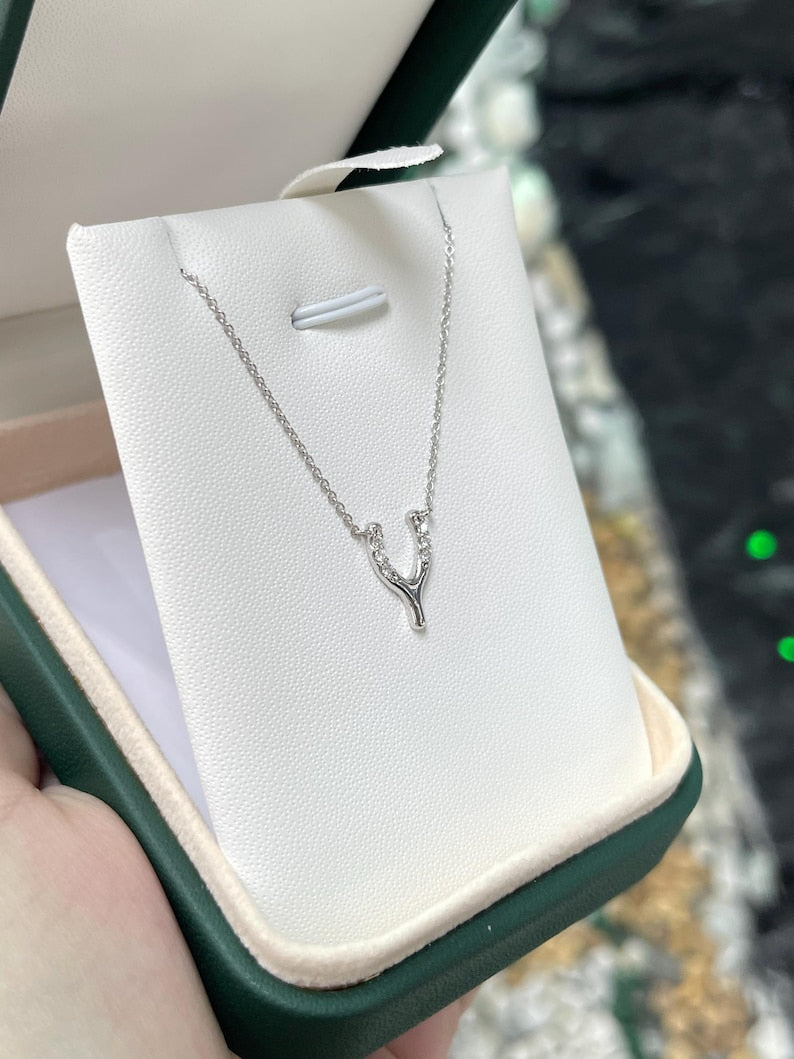 14K gold Y-shaped horse shoe diamond pendant necklace with white gold finish, featuring 0.10 tcw diamonds from Colombian Emerald.