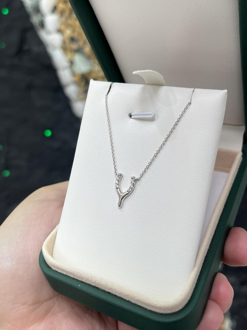 14K gold Y-shaped horse shoe diamond pendant necklace with white gold finish, featuring 0.10 tcw diamonds from Colombian Emerald.