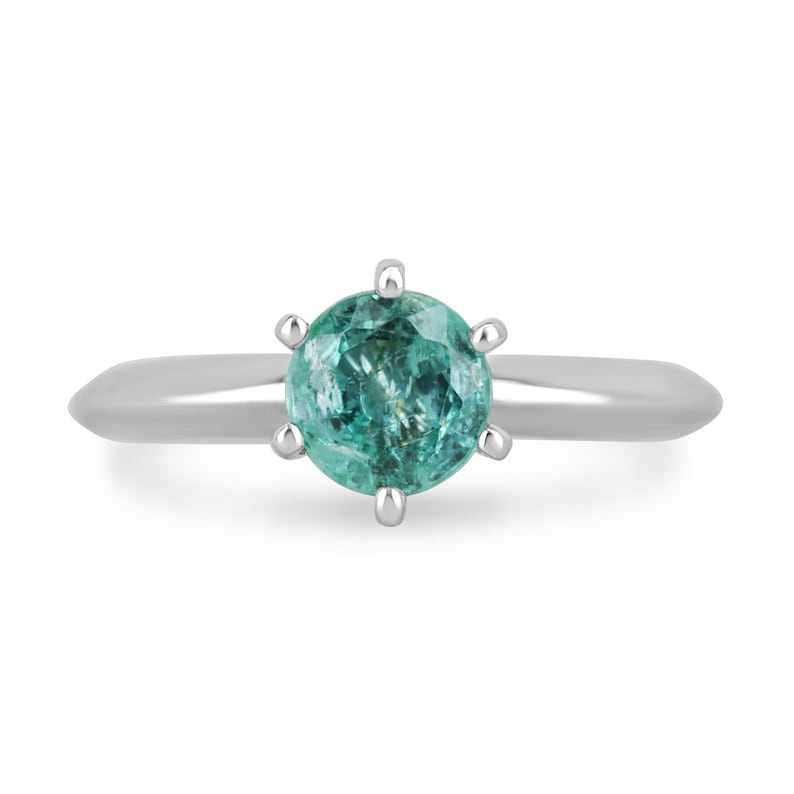 Colombian Emerald 0.80ct round cut ocean blue engagement ring with six prongs in 14K gold, showcasing an elegant jewelry design.