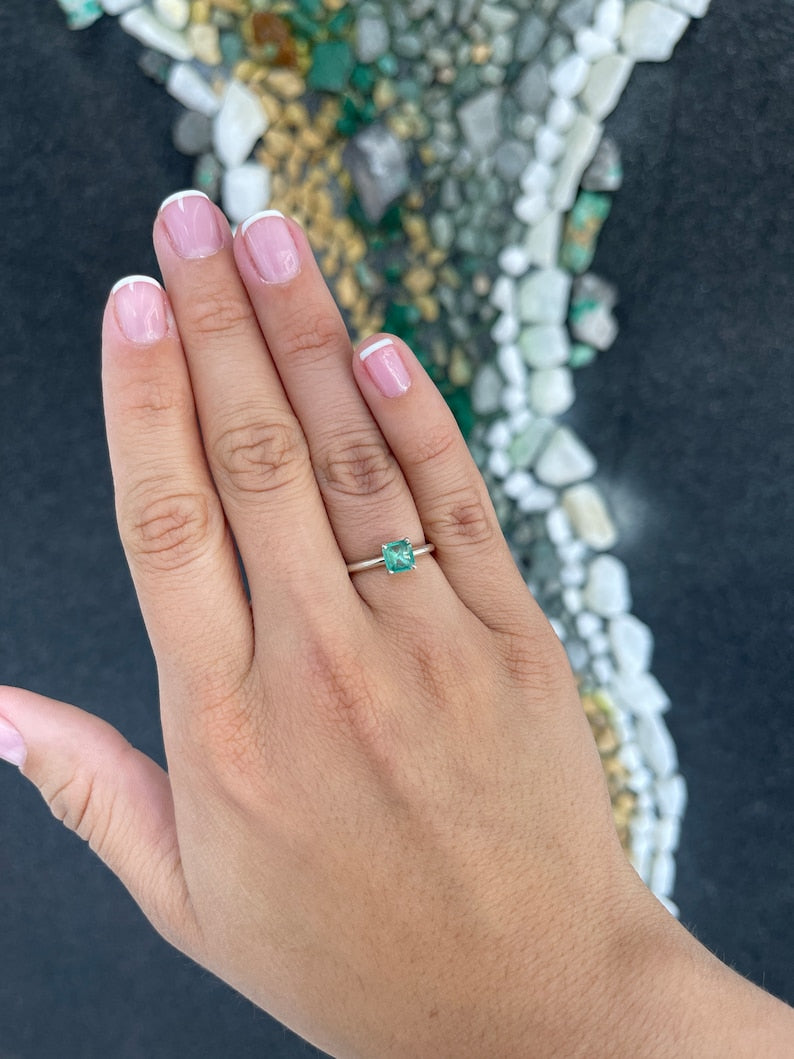 Natural spring green Asscher cut emerald solitaire ring in sterling silver, featuring a 0.90 carat Colombian emerald.