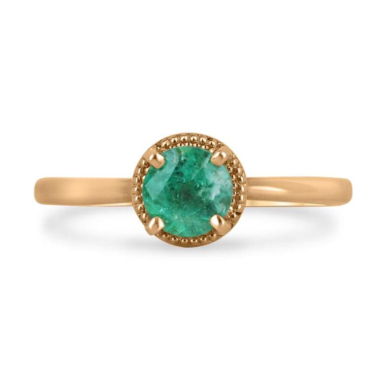 14K rose gold engagement ring with a 0.90ct round cut emerald solitaire on a right hand, from Colombian Emerald brand.