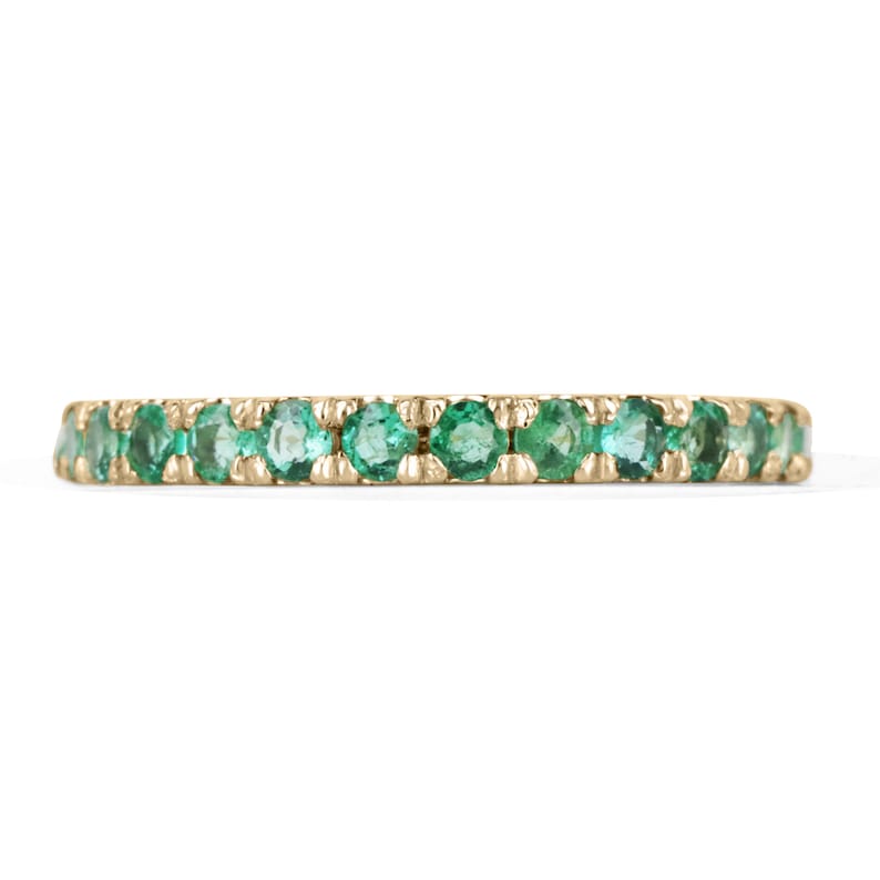 Medium dark green round cut emerald half eternity band ring in 14K gold with 0.90tcw Colombian Emeralds.