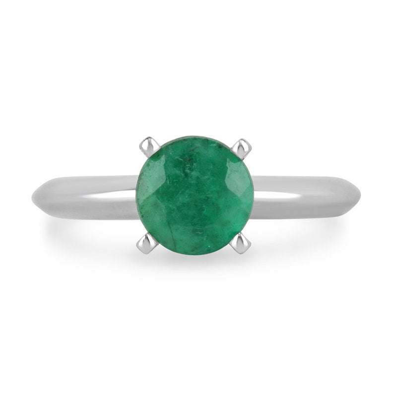14K white gold engagement ring with a 0.93ct medium dark green emerald round cut in a 4-prong solitaire setting