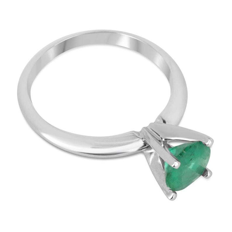 14K white gold emerald engagement ring with a 0.93ct round cut dark green Colombian emerald and four-prong setting.