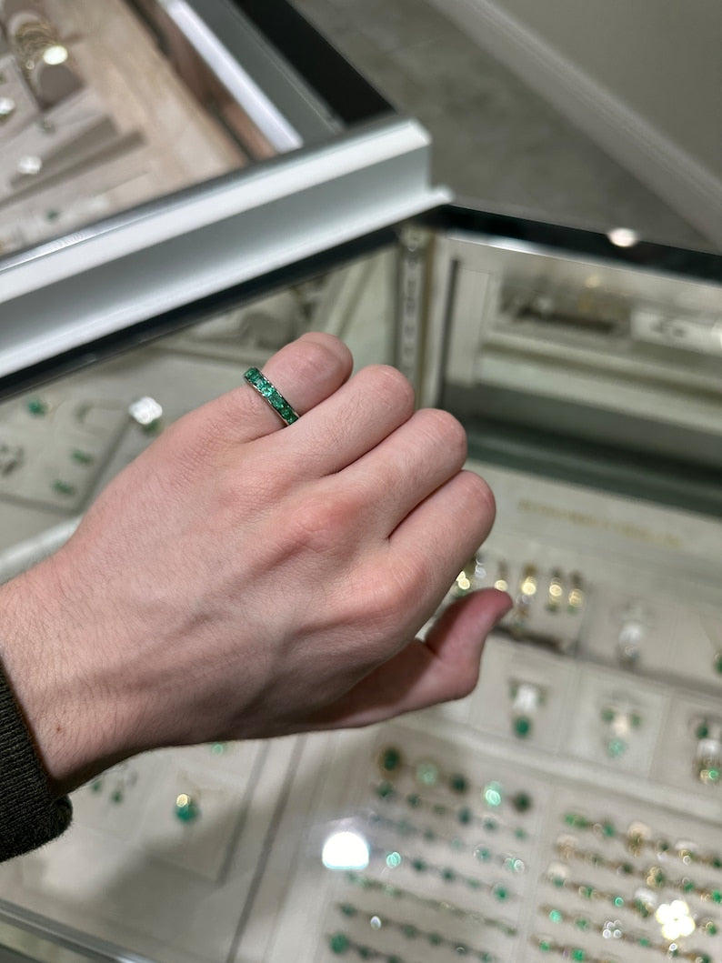 14K white gold unisex wedding band featuring a 1.35tcw princess cut green emerald from Colombian Emerald.