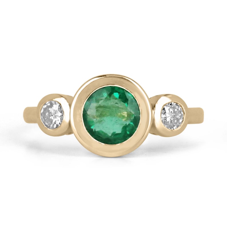 14K gold engagement trilogy ring featuring a round cut medium spring green emerald and diamonds by Colombian Emerald.