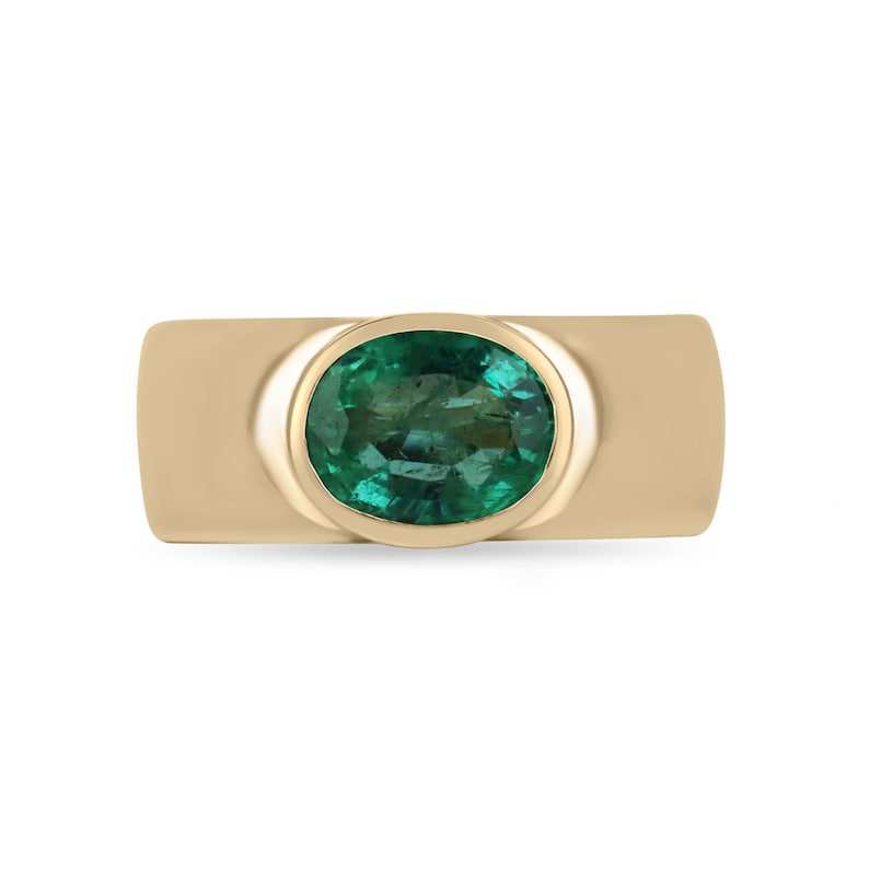Unisex 1.80 carat natural medium green oval cut Colombian Emerald solitaire ring in 14K gold.
