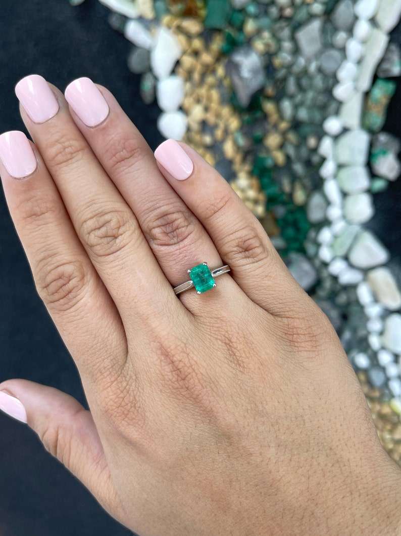 14K Colombian Emerald engagement ring featuring a 1.95 carat four-prong solitaire emerald gemstone.