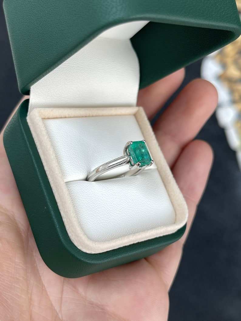 14K Colombian Emerald engagement ring featuring a 1.95 carat four-prong solitaire emerald gemstone and gold band.