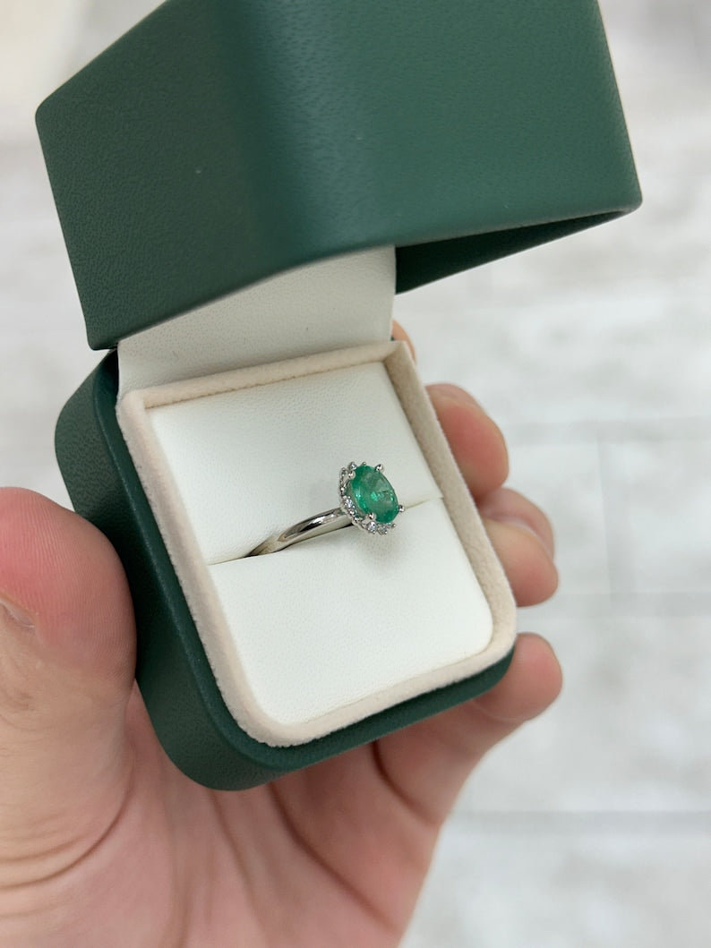 14K gold emerald ring with oval cut emerald centerpiece and petite dark green diamond accents, Colombian Emerald brand.