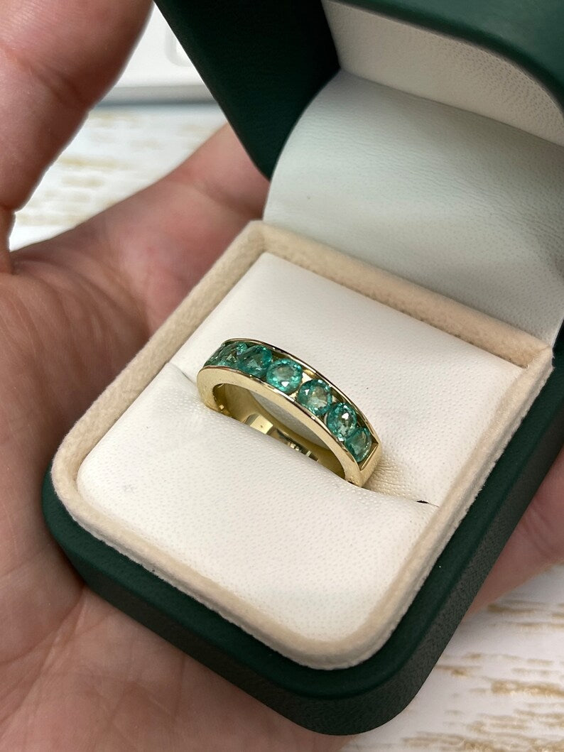 14K gold unisex engagement band ring with round cut emeralds and channel setting, 5.3mm wide, by Colombian Emerald.