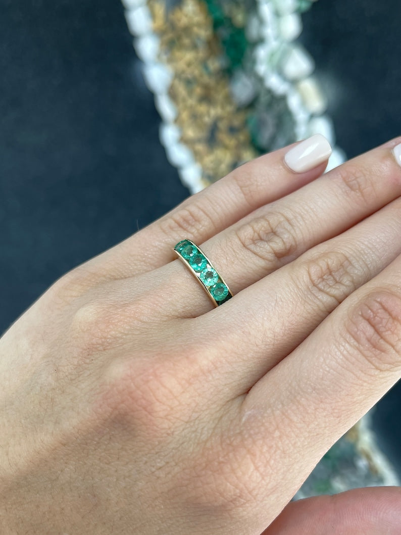 14K gold unisex engagement band ring with 2.30tcw round cut emeralds in a channel setting, Colombian Emerald brand, 5.3mm wide.