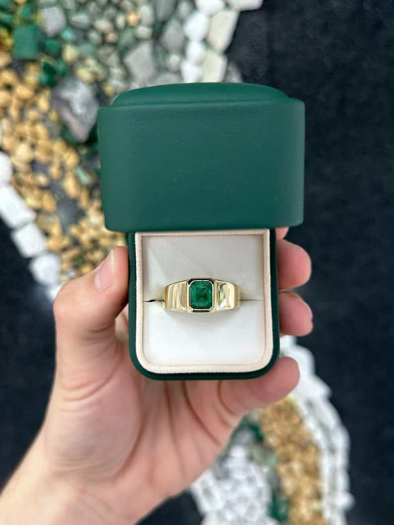 14K gold men's ring with 2.65ct lush dark green emerald cut Colombian emerald, set north to south.