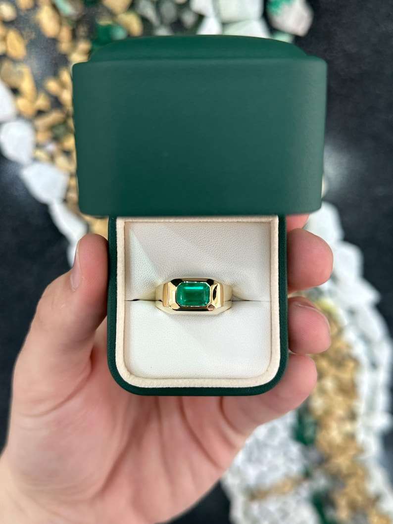 Colombian Emerald 2.70ct AAA+ rich vivid green Muzo emerald cut solitaire gypsy ring with east-west setting on a ring band
