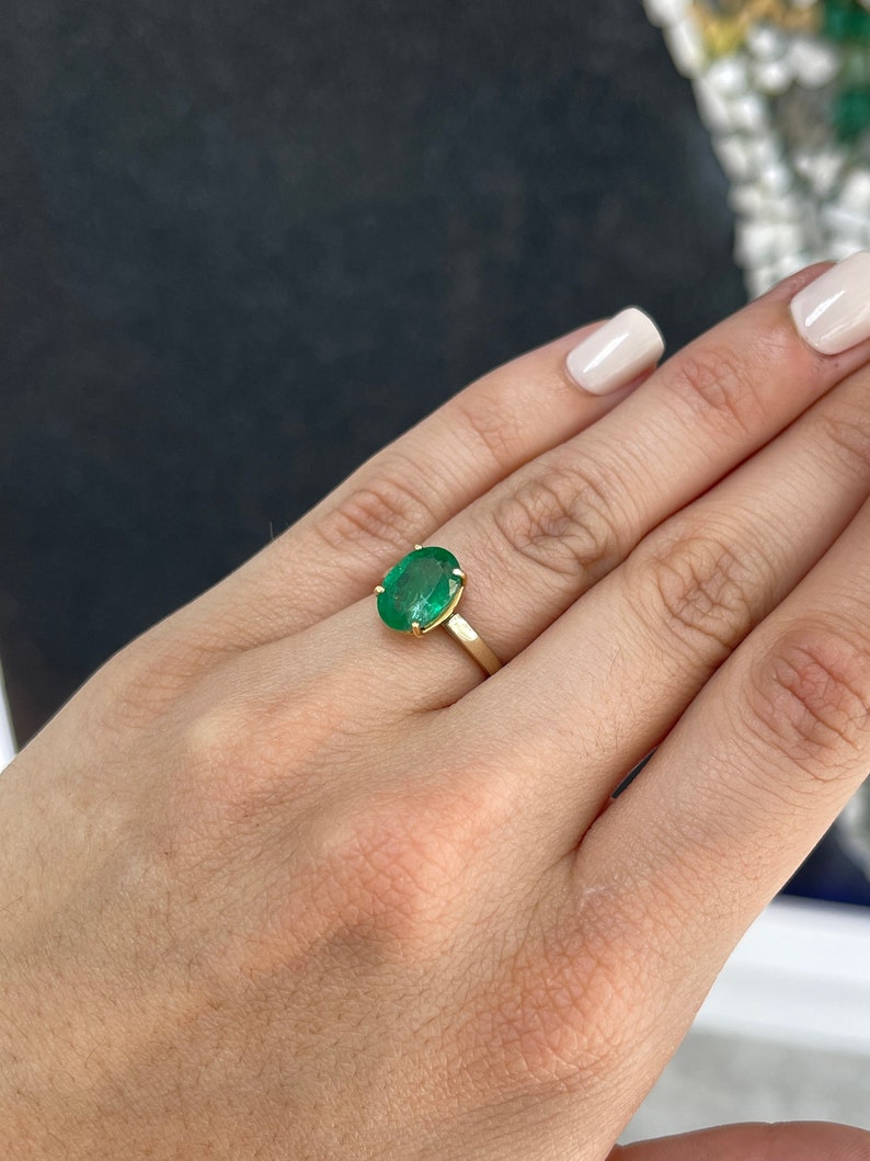 14K gold oval cut forest green emerald solitaire ring with 4 prongs, right hand jewelry by Colombian Emerald.