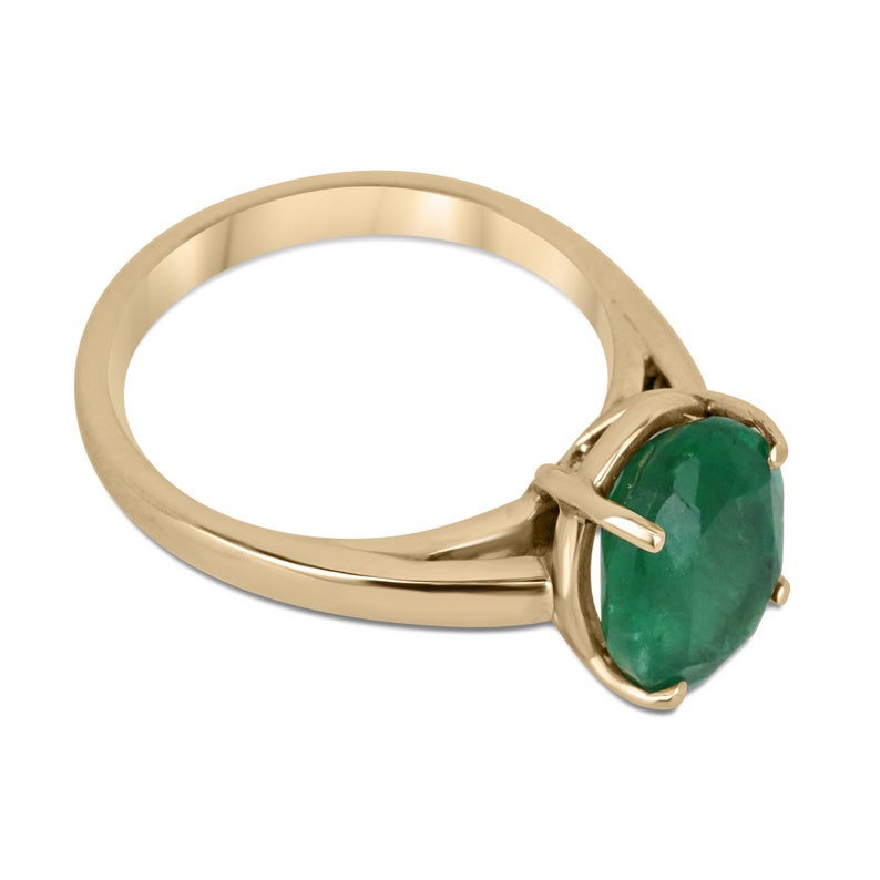14K gold oval cut forest green emerald solitaire ring with 4 prongs, designed for right hand, by Colombian Emerald.
