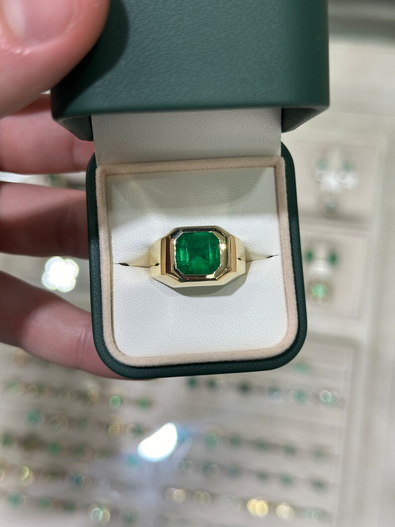 Deep green 3.60 carat Colombian Emerald Asscher cut men's ring with 18K gold band, featuring a chunky unisex solitaire design.