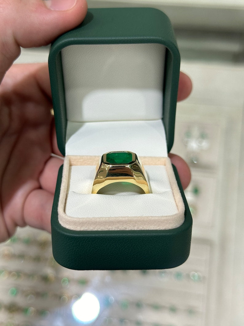 Deep green Colombian emerald Asscher cut men's ring with 18K gold setting, unisex chunky style, and 3.60 carats of fine quality gemstones.