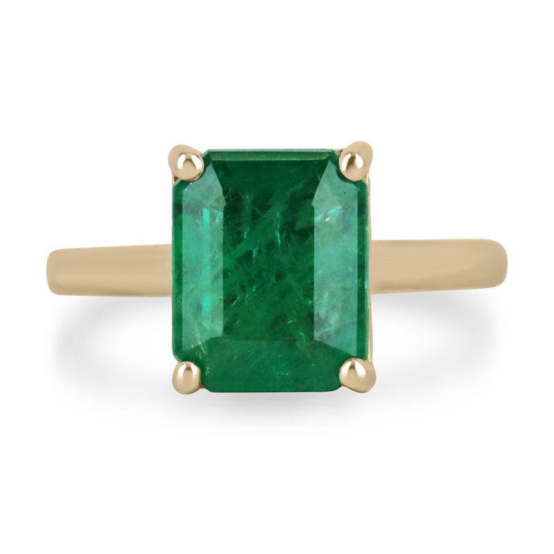 18K gold emerald solitaire ring with a 3.95ct rich green Colombian emerald and four-prong setting, designed for right hand wear