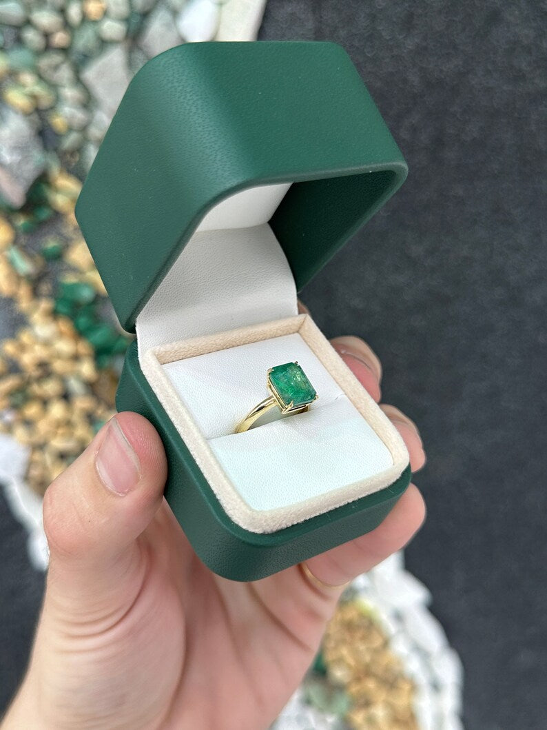 14K gold emerald cut solitaire engagement ring with a 4.08ct rich green emerald from Colombian Emerald, featuring a 4-prong setting.